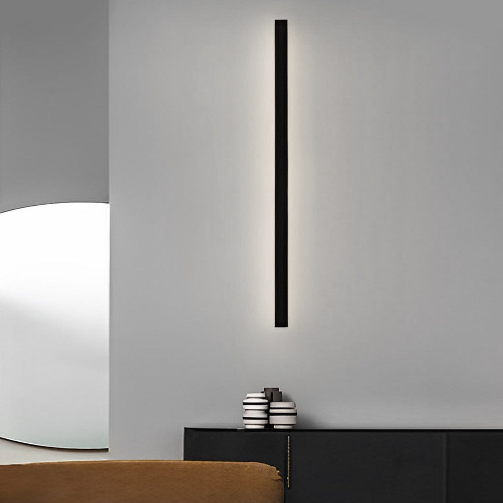 Outdoor linear wall light used as subtle ambient lighting on residential exterior wall surface.