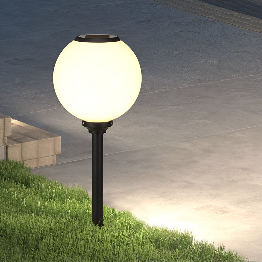 Outdoor path light globe providing elegant illumination for a contemporary garden.