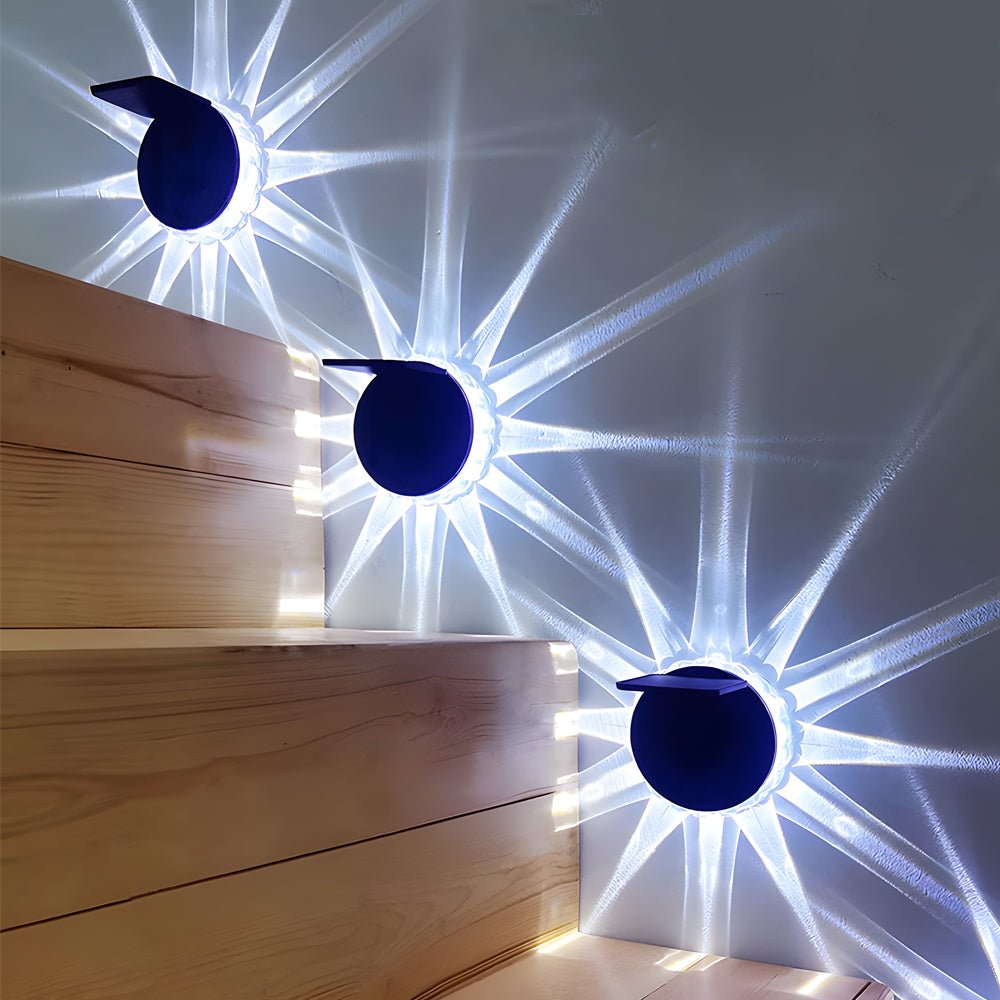 Outdoor patio solar lights adding a vibrant blue and white glow to a cozy outdoor seating area.
