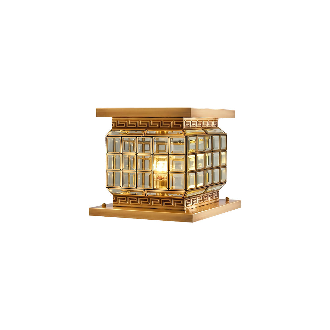 Compact outdoor pillar lights solar in gold finish isolated on white background with warm lighting.