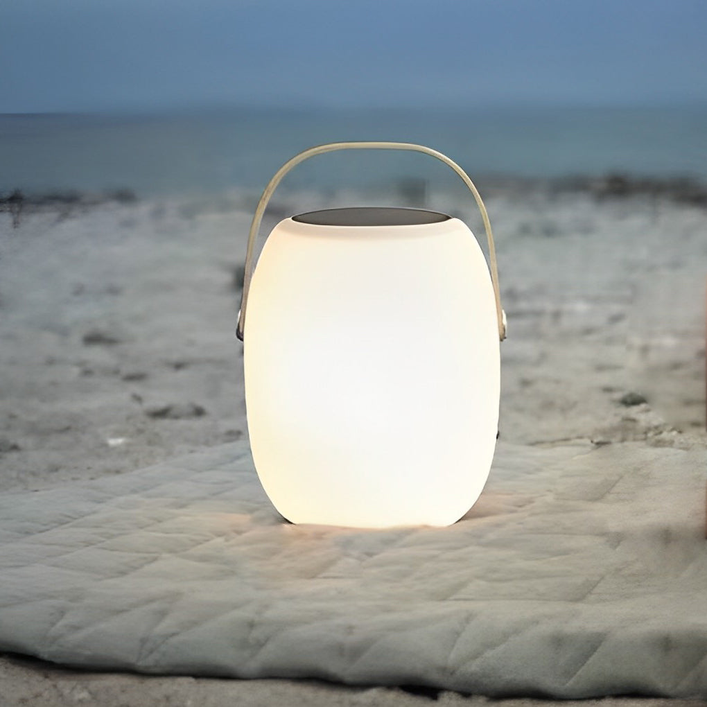 Outdoor solar floor lanterns illuminating garden pathway with soft glow.