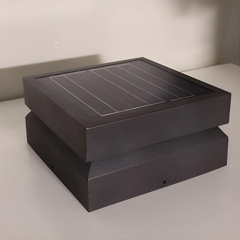 Outdoor solar lights deck with square design, glowing on stone surface at night.