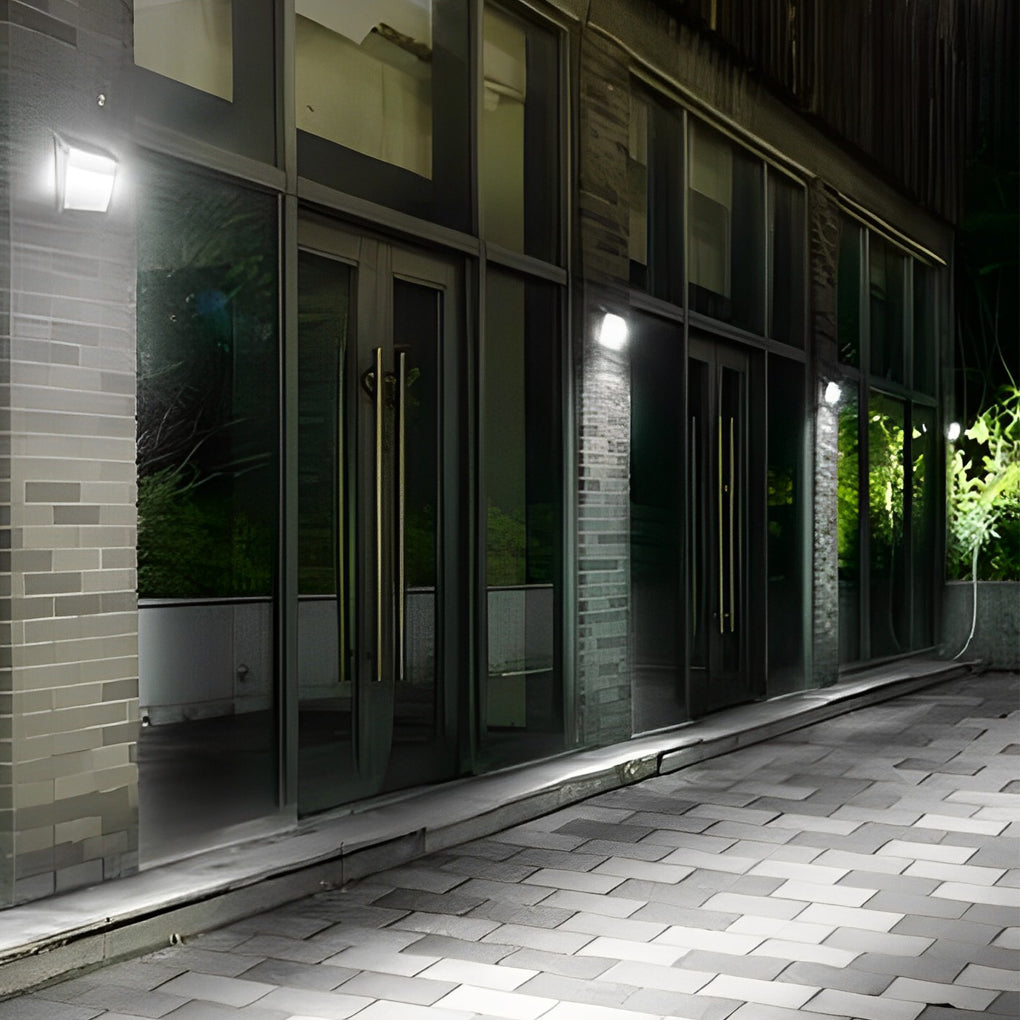 Outdoor solar wall light with motion sensor with a close-up of the solar panel and light.