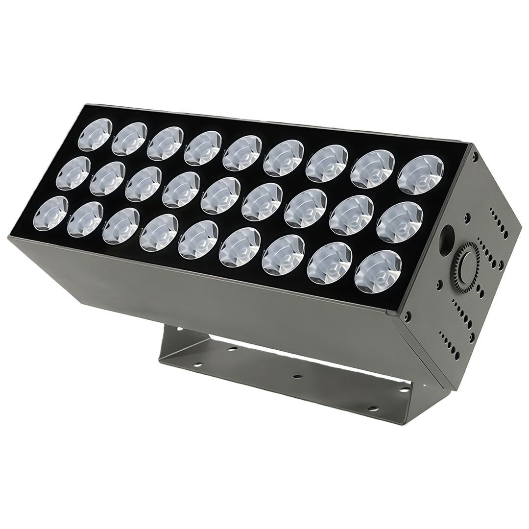 Ground-mounted LED square wall wash light illuminating concrete wall.