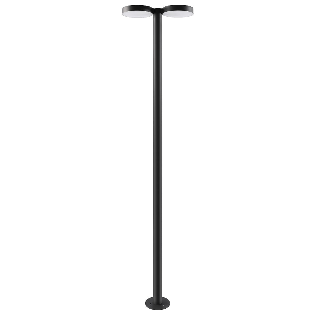Outdoor street light fixture mounted in a garden, providing ambient lighting.