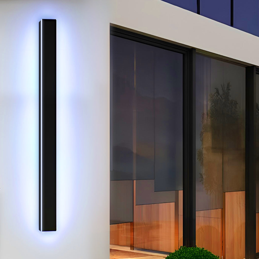 Outdoor strip wall light with colorful RGB illumination on a white wall.