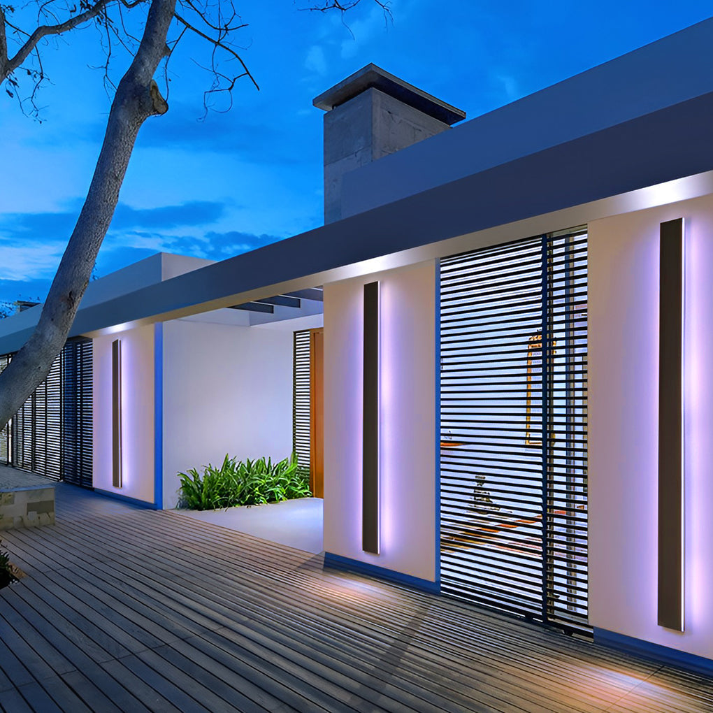 Outdoor strip wall light illuminating a pathway with vibrant colors.