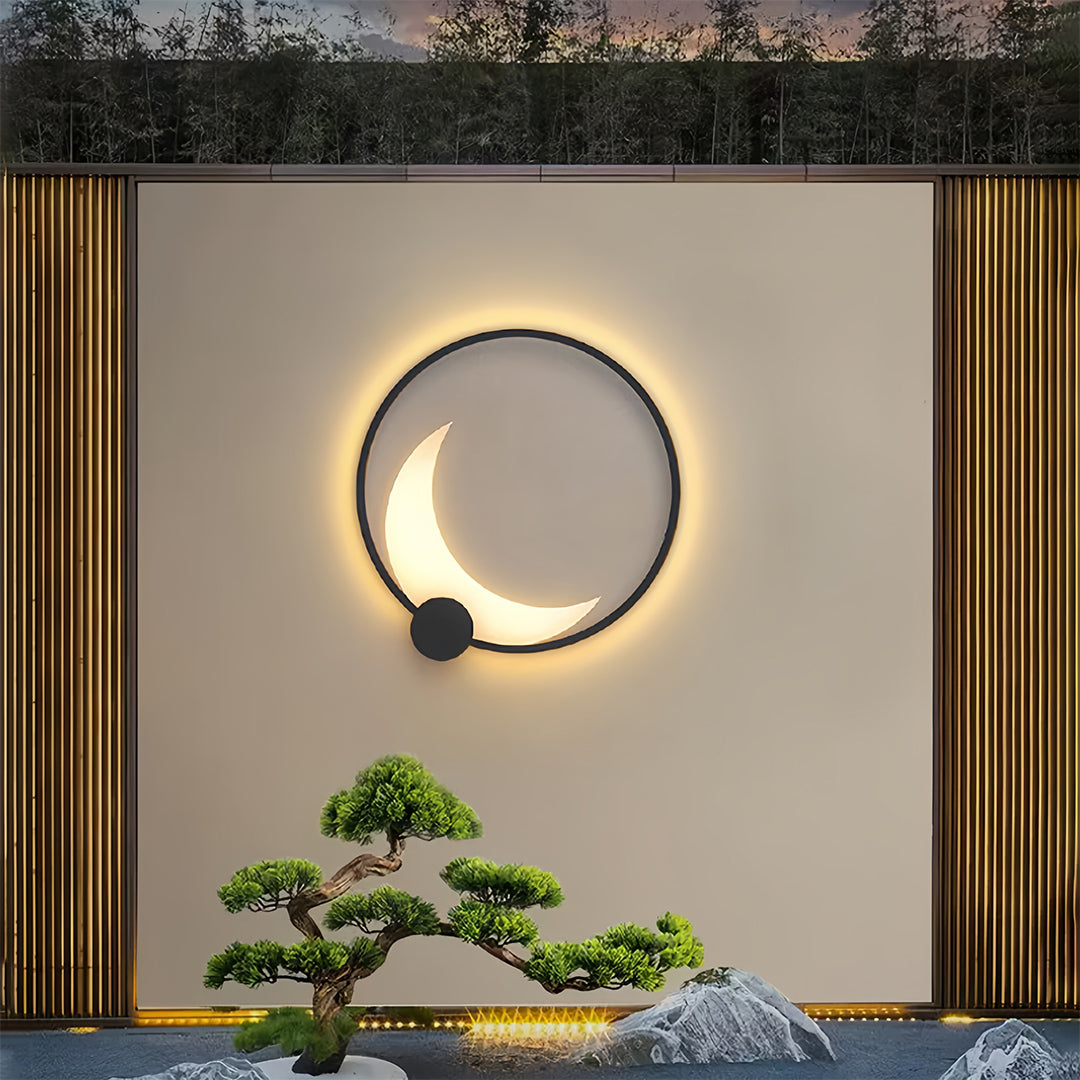 Decorative outdoor wall light with bonsai tree creating zen-inspired entrance lighting composition