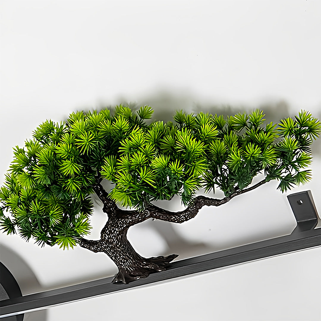 Outdoor wall lights combined with decorative greenery on a modern exterior wall.