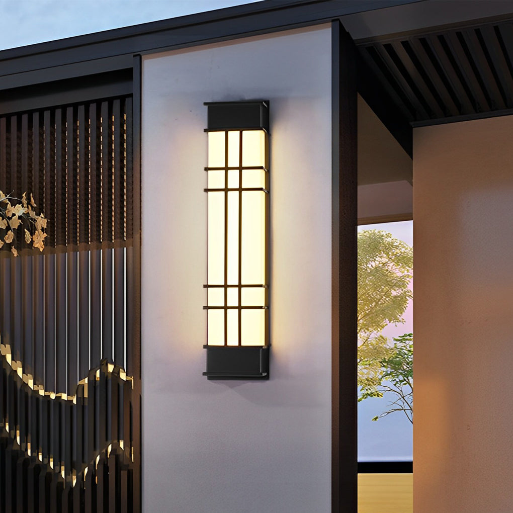 Outdoor wall sconce black providing ambient lighting near a modern building facade.