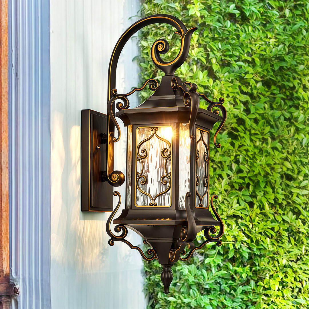 Outdoor wall sconce lights on beige wall surrounded by lush green vines.