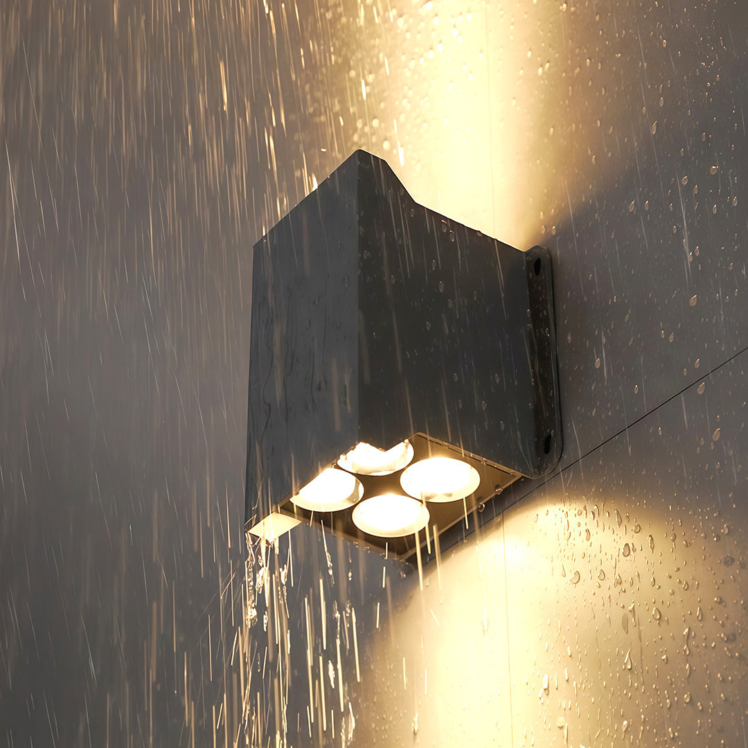 Backside of outdoor wall wash lights showing mounting holes and wiring.