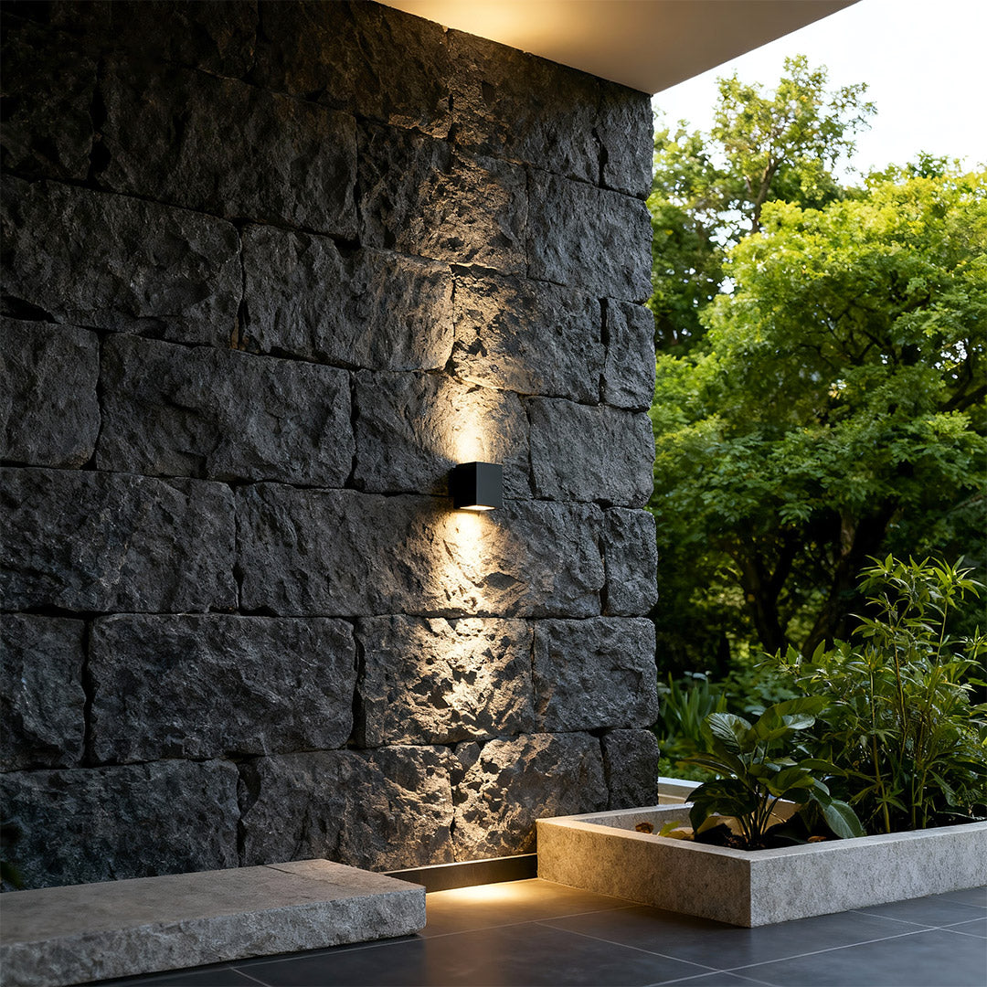 Outdoor wall wash lights mounted on villa exterior, highlighting the façade.