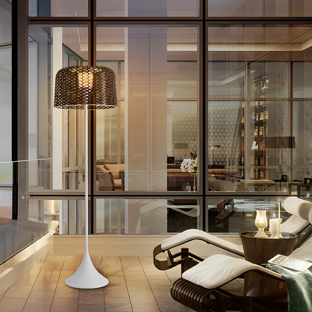 Outdoor waterproof floor lamps positioned beside glass walls, creating elegant accent lighting for exterior spaces.