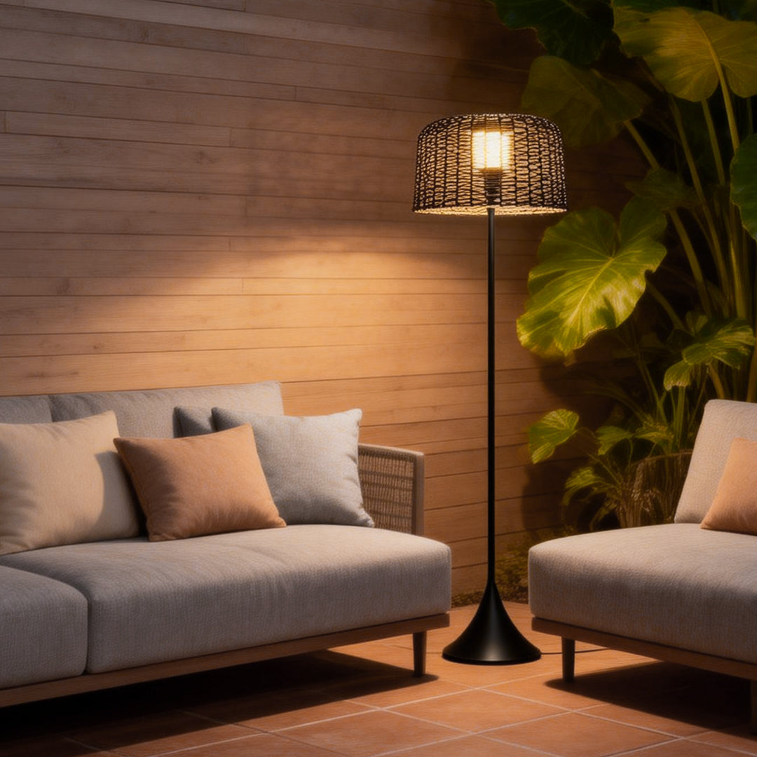 Outdoor waterproof floor lamps beside an outdoor sofa, providing cozy illumination for evening gatherings.