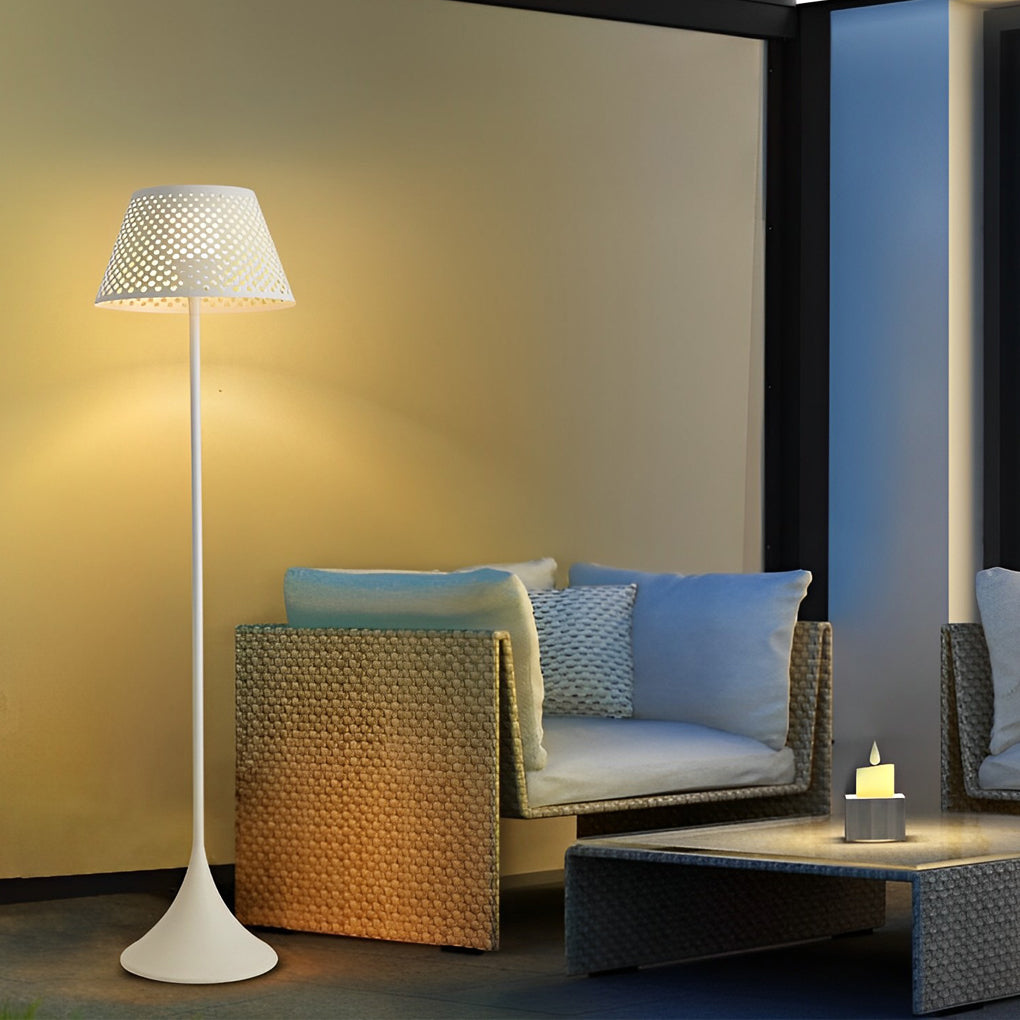 Outdoor waterproof floor lamps with white finish illuminating a cozy balcony seating area at night.