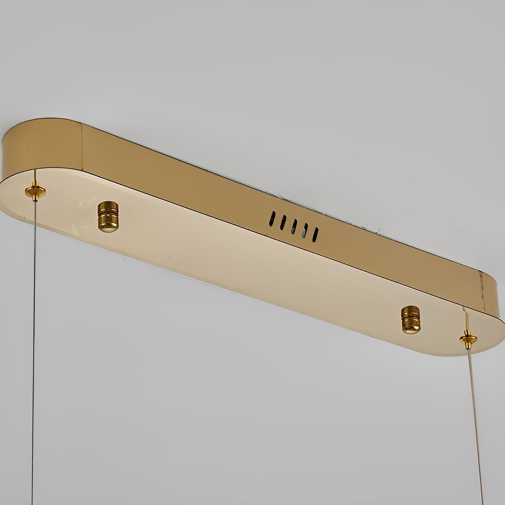 Oval crystal chandelier with a gold finish, providing ambient lighting in a living room.