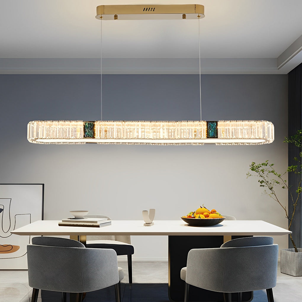 Oval crystal chandelier with a sleek design, enhancing a contemporary dining room.