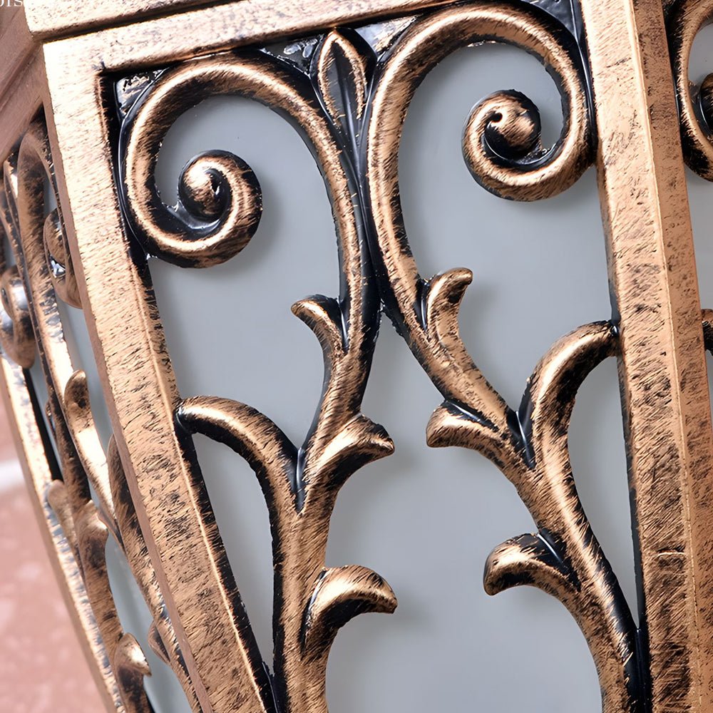Pair of antique art deco wall sconces in bronze, displayed against a white background, highlighting their symmetrical design.