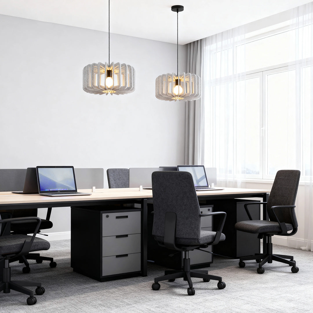 Pair of natural wood slat Nordic pendant lights over a bright office meeting desk.