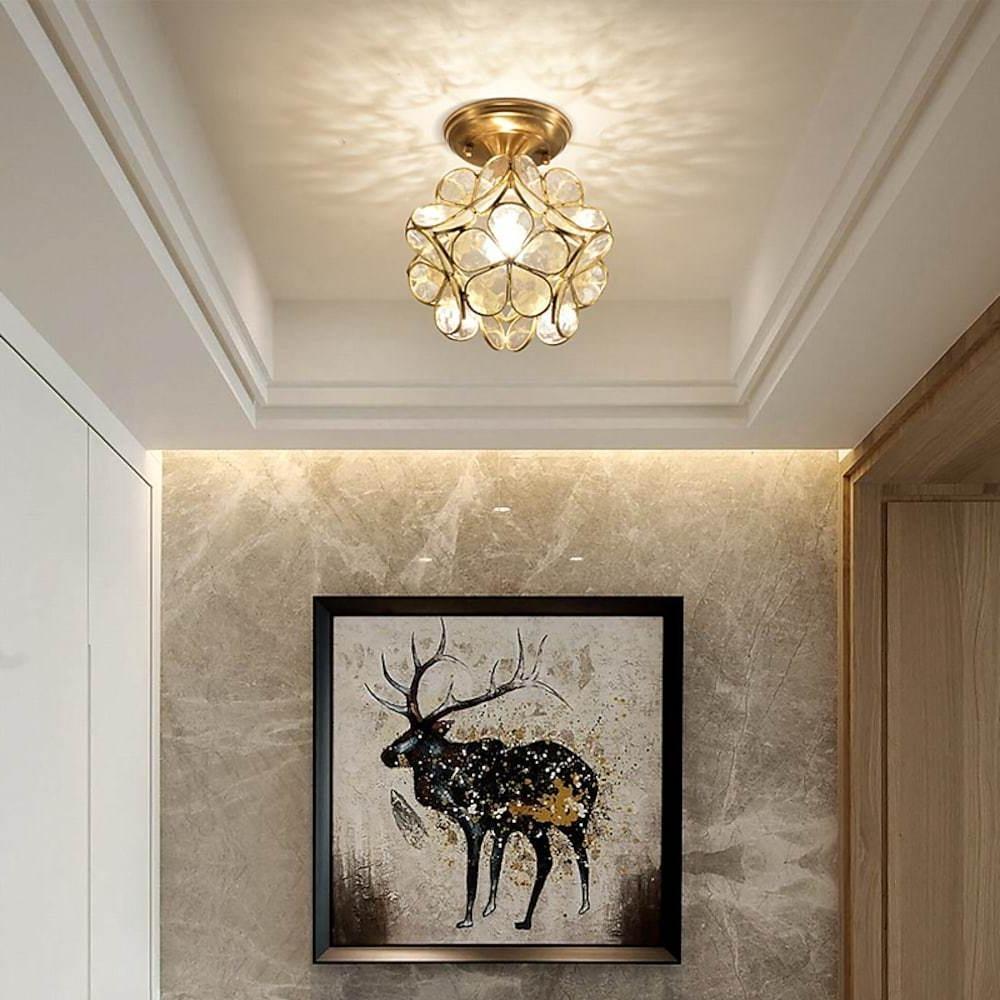 Petal shaped ceiling lights with a close-up of the crystal petals and gold frame.
