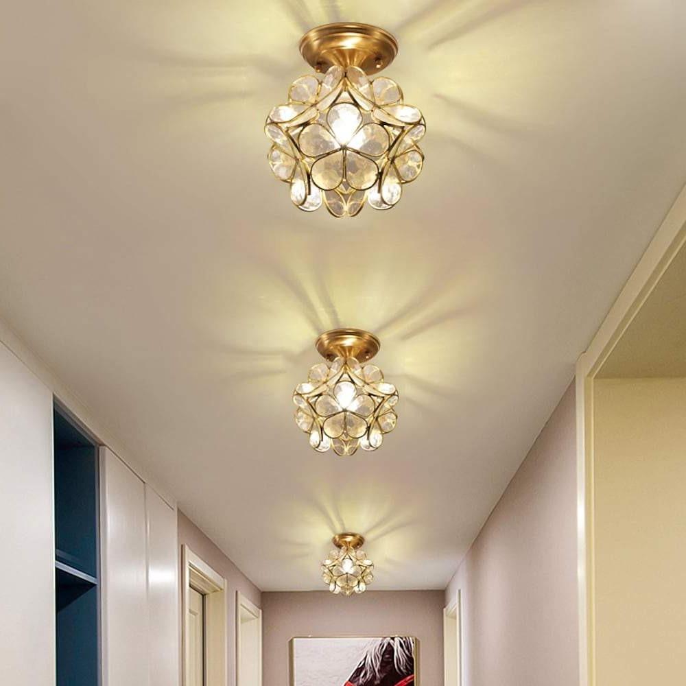 Petal shaped ceiling lights illuminating a modern living space with ambient light.