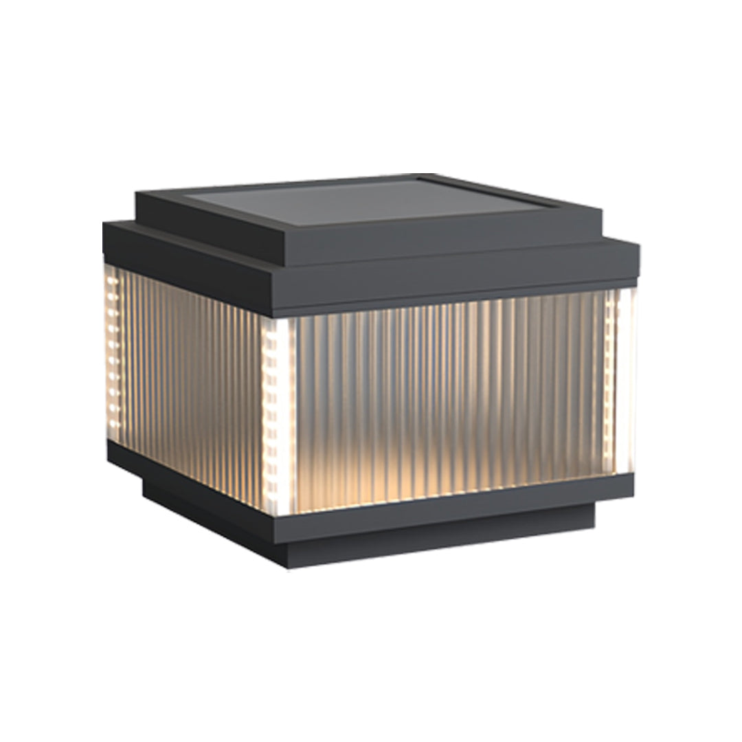 Modern pillar lighting outdoor unit featuring a square structure and warm interior glow.