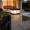 Pillar lights outdoor solar installed on modern concrete fence post with warm evening illumination.