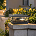 Pillar lights outdoor mounted on stone column beside garden greenery creating elegant evening illumination
