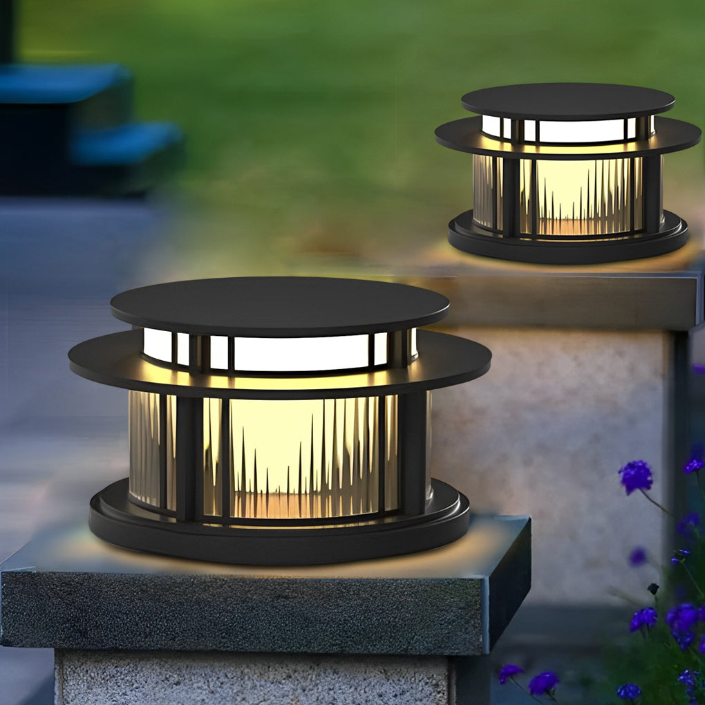 Pillar solar light installed on outdoor stone post providing warm pathway lighting.