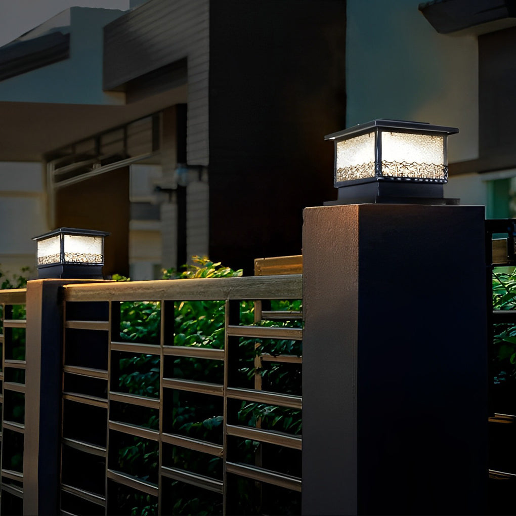Pillar solar lights for outdoors installed on modern fence posts, adding decorative lighting to a contemporary exterior.