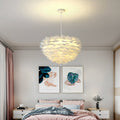 Pink feather pendant light adds elegant modern style to your ceiling. Perfect for bedrooms, dining rooms, or living spaces.