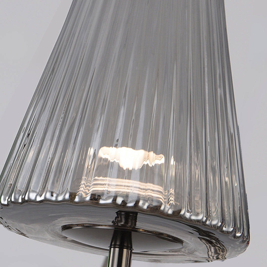 Close-up detail of pleated glass lampshade showing textured surface and light diffusion pattern