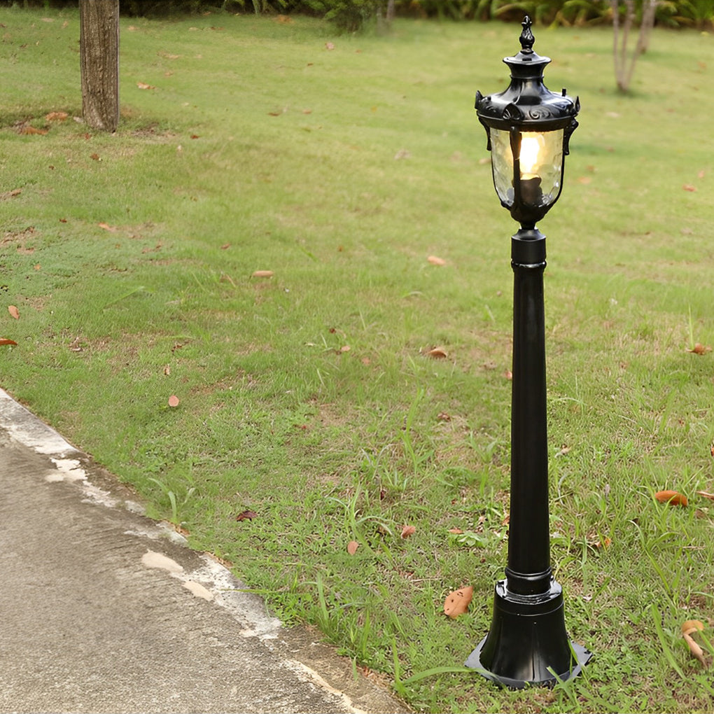Poles for yard lights enhancing a garden with elegant, traditional design.