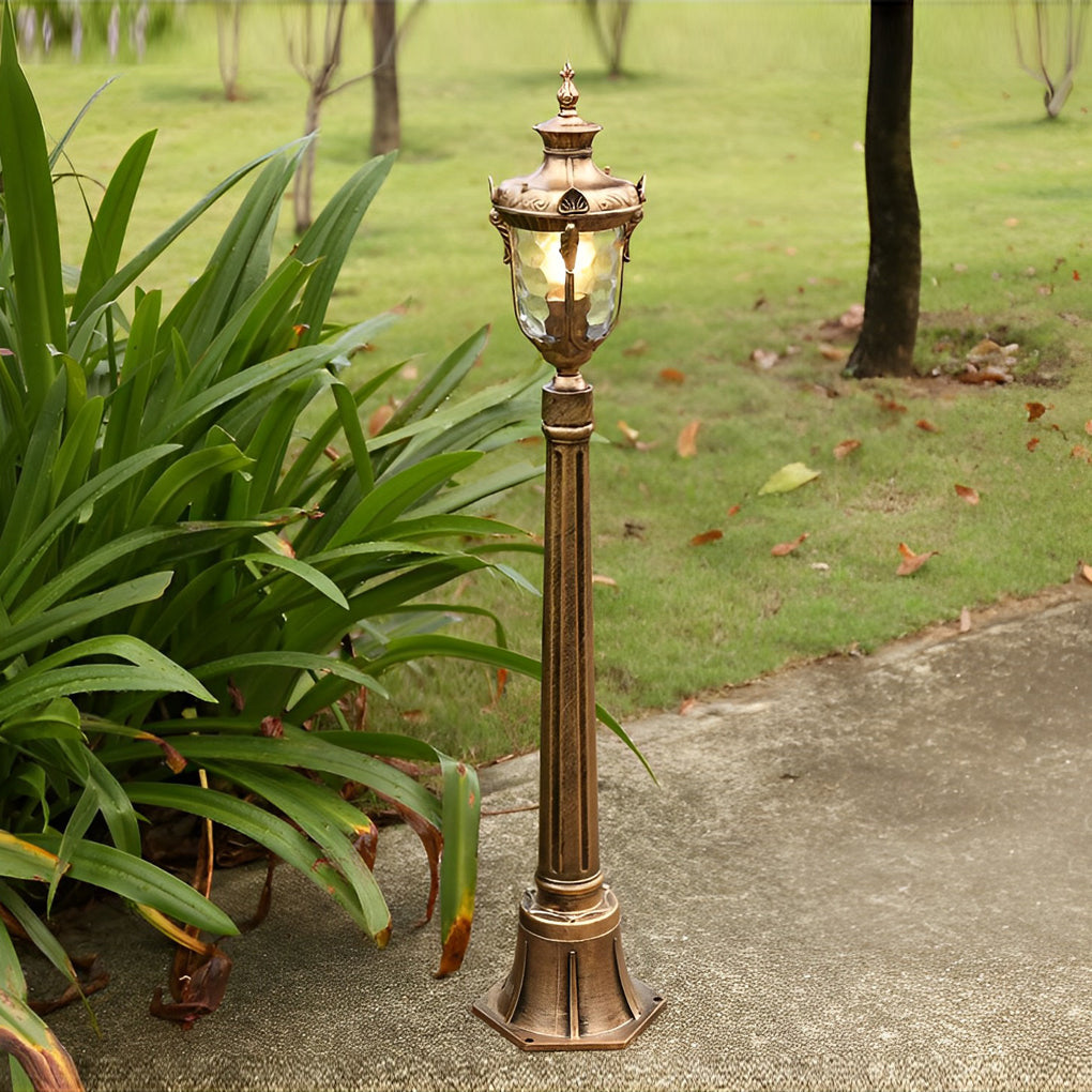 Poles for yard lights casting a gentle glow on a rainy evening.
