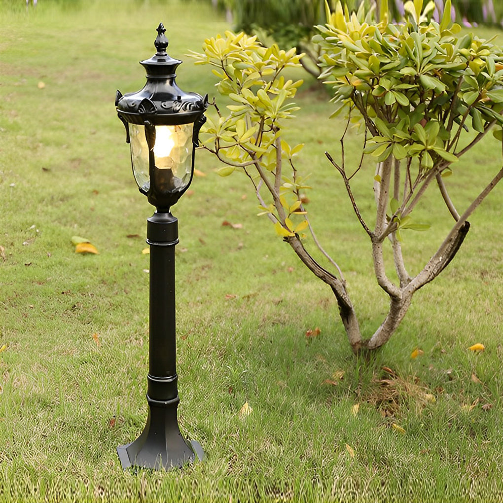 Poles for yard lights standing in a lush garden, providing classic outdoor illumination.