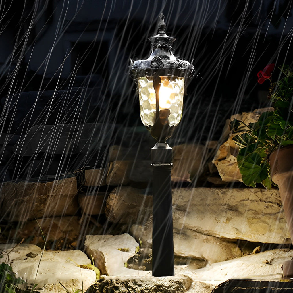 Poles for yard lights illuminating a patio area with soft, ambient light.