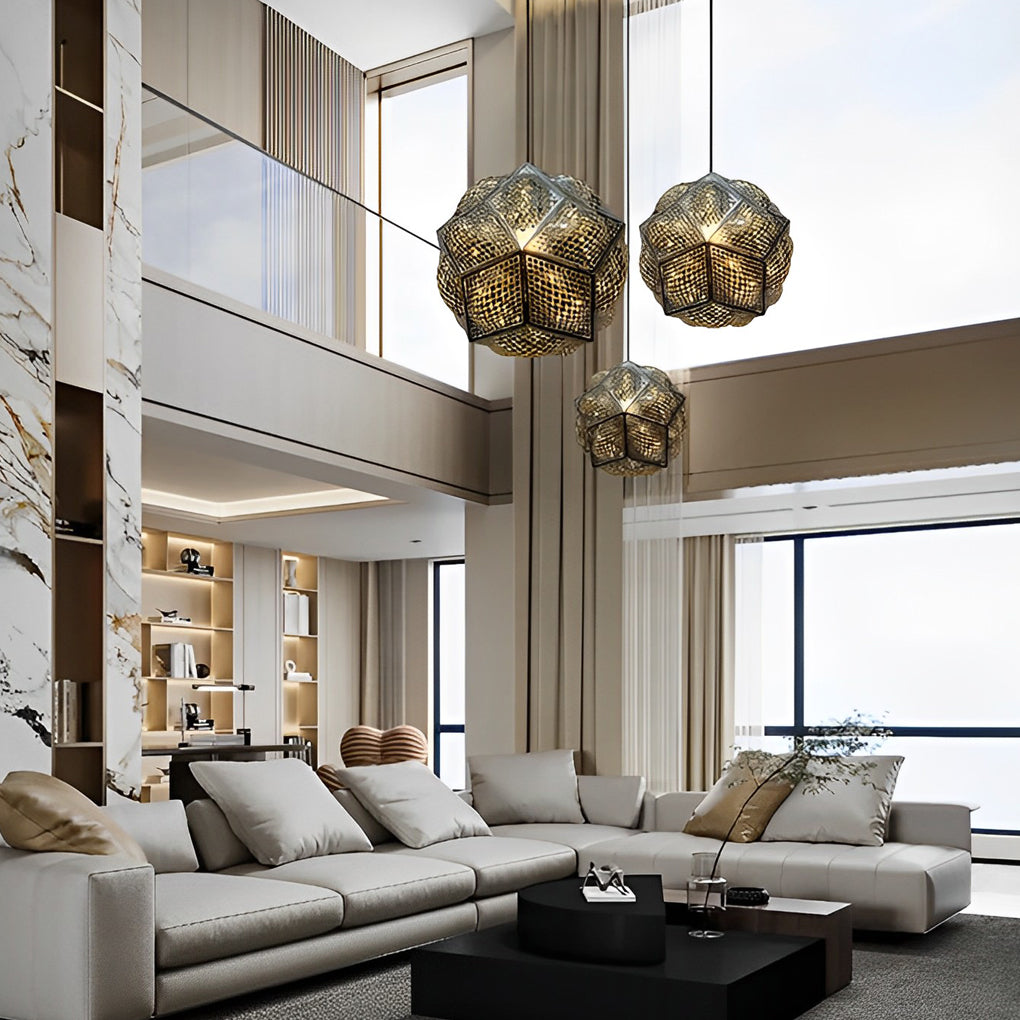 Polyhedron pendant light with a modern geometric design, hanging above a dining table.