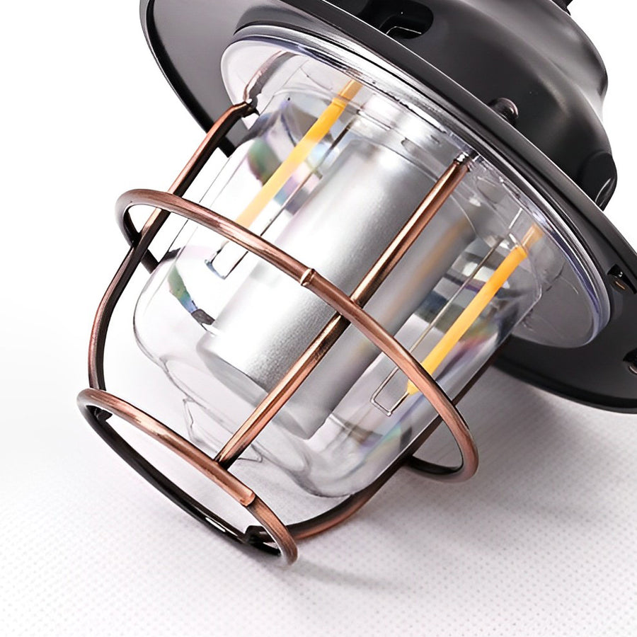 Portable hanging light in black, showcasing its sturdy handle and classic design.