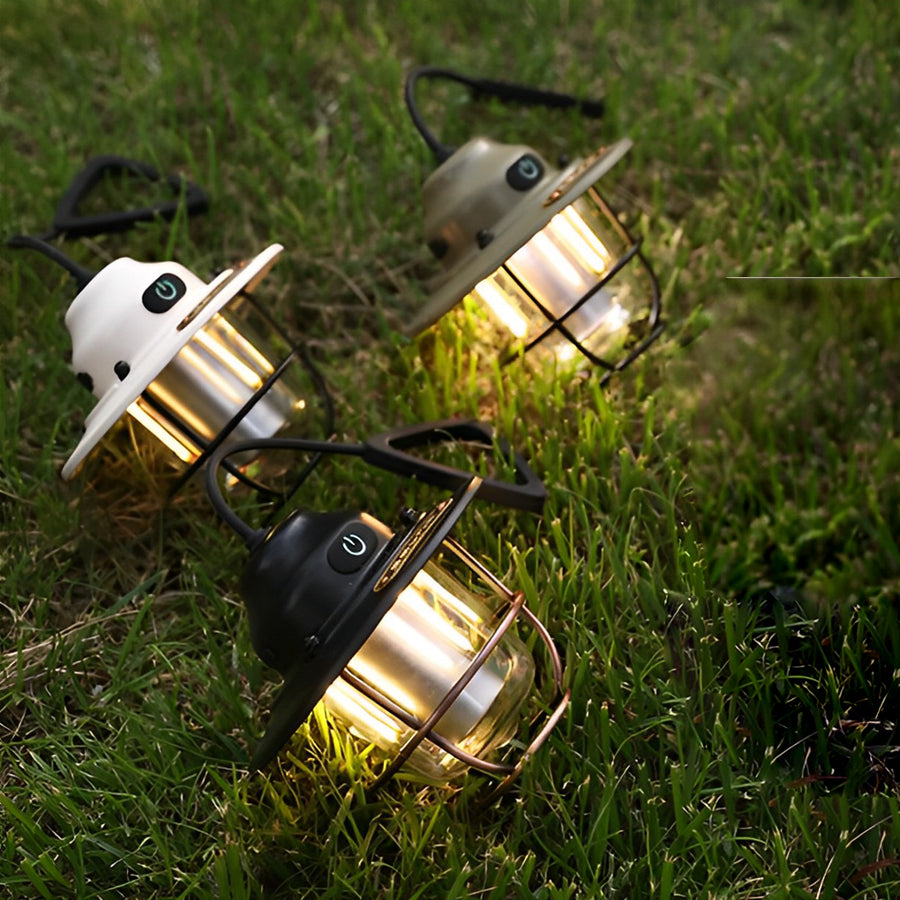 Portable hanging light in olive green, providing ambient light for an outdoor adventure.