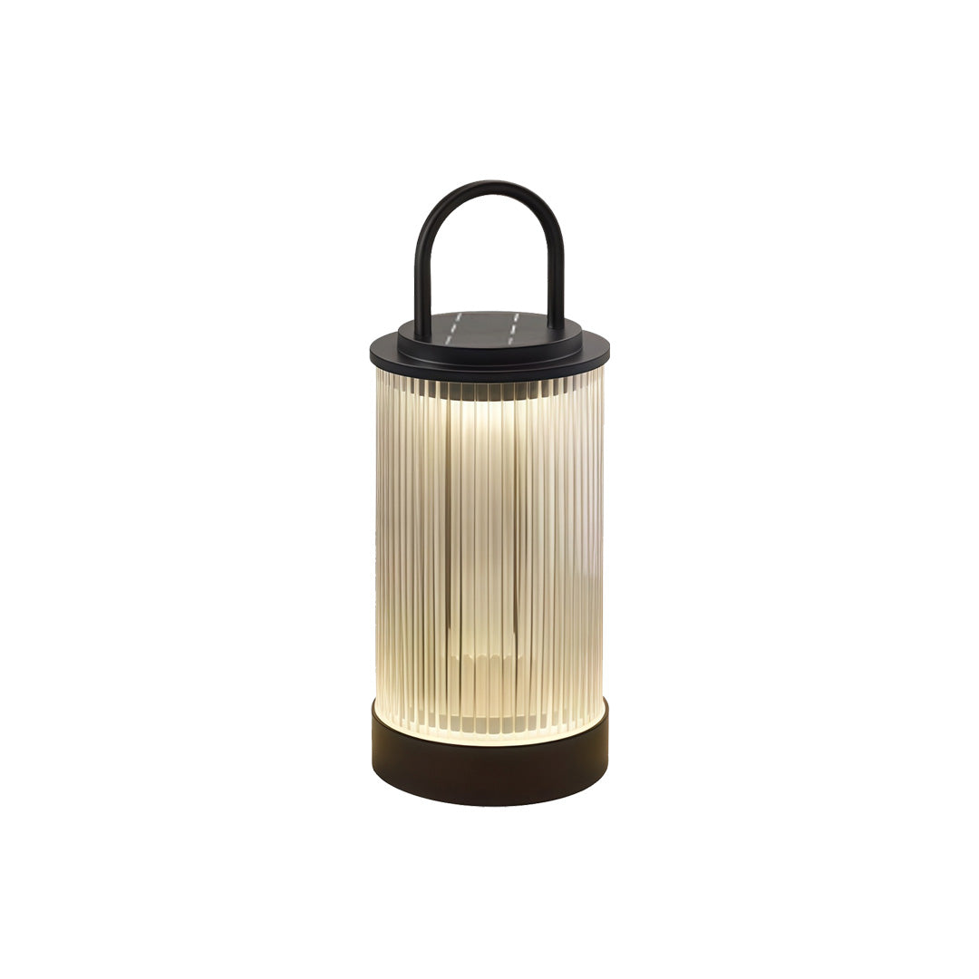 Portable lantern positioned on garden walkway stone pillar adding warm decorative night lighting.