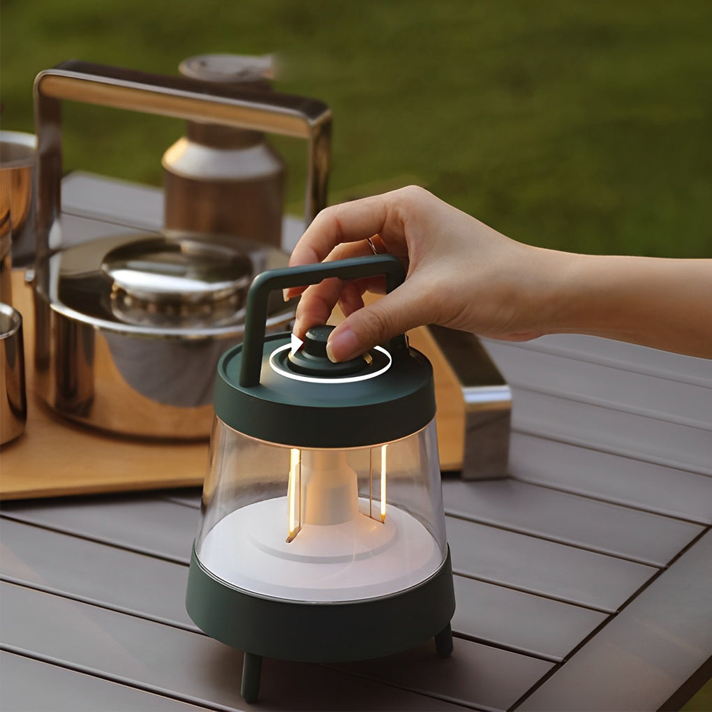 Portable rechargeable LED lamp with a modern design, illuminating a camping table.
