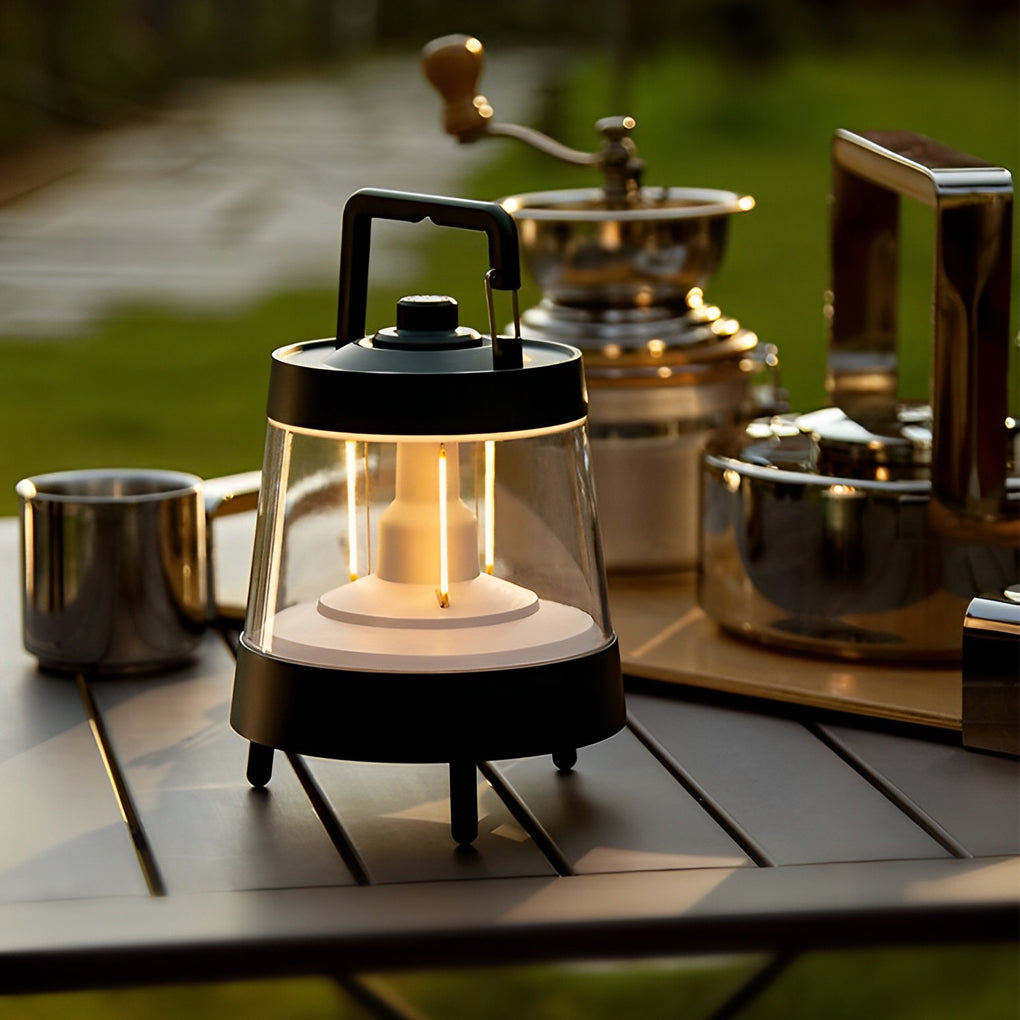 Portable rechargeable LED lamp providing soft light during an outdoor coffee setup.