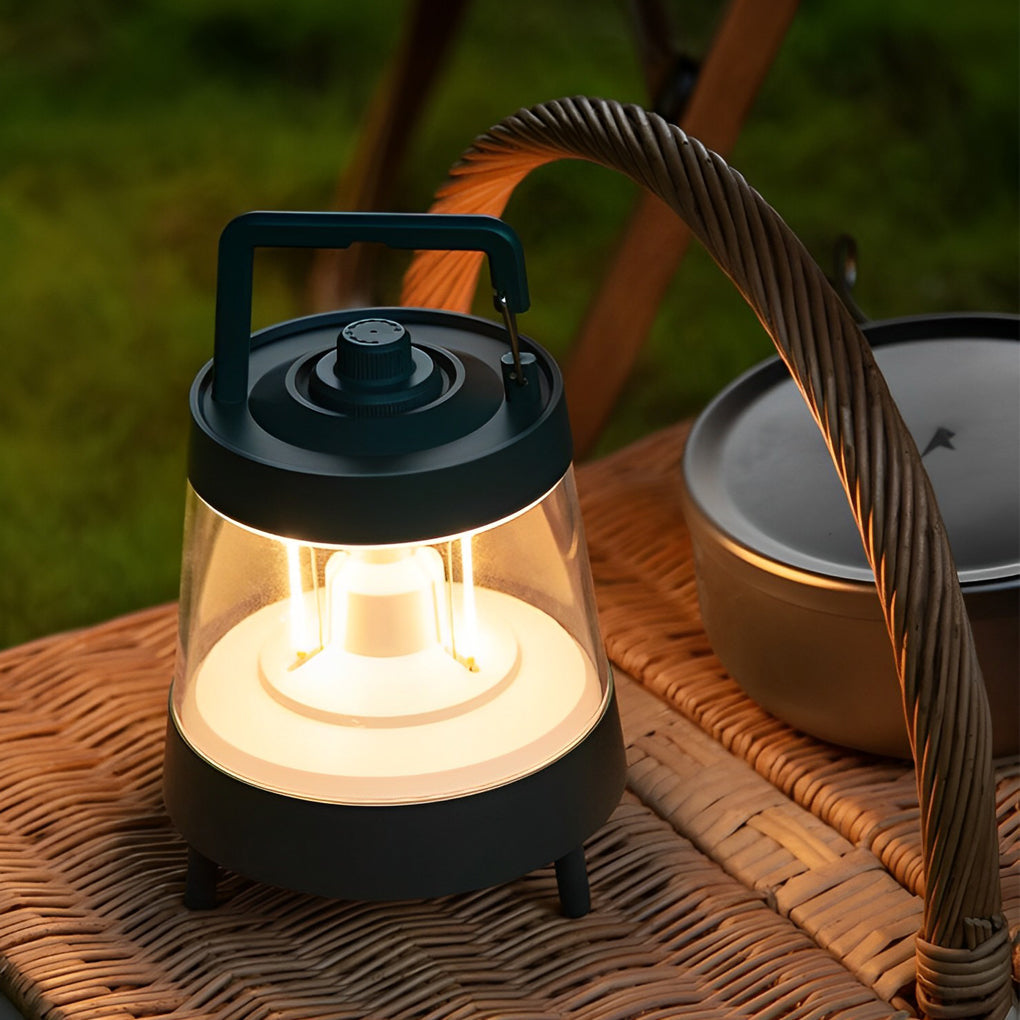 Portable rechargeable LED lamp providing warm light near a smartphone.