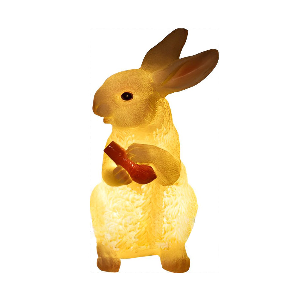 Rabbit garden light with a warm glow, displayed against a plain white background.