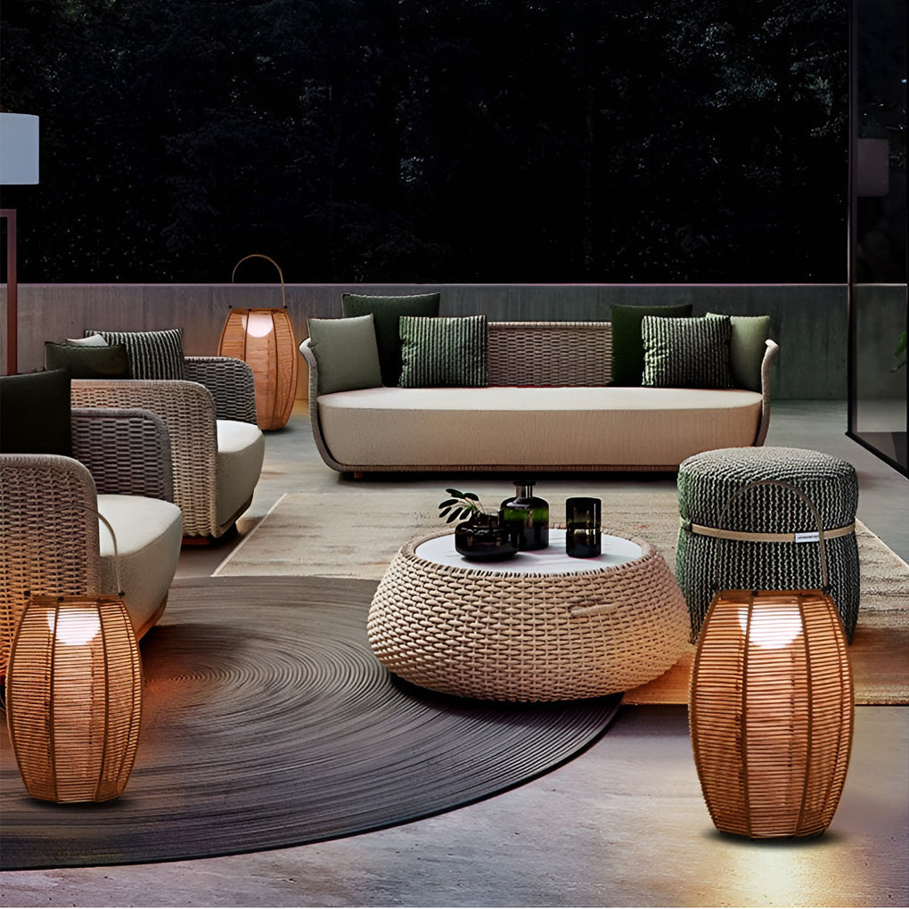Rattan floor lantern with side view showing depth and light diffusion.