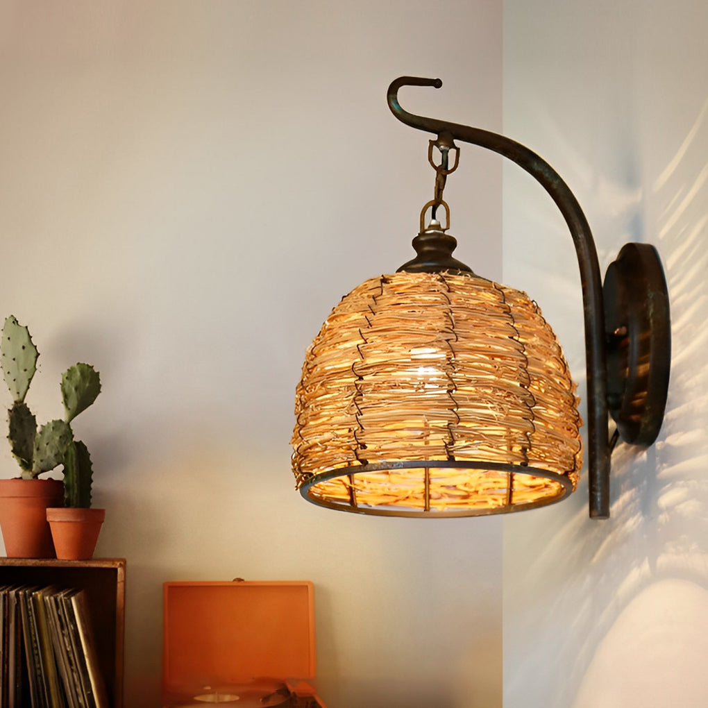 Rattan wall lamp with a close-up of its woven texture and warm light.