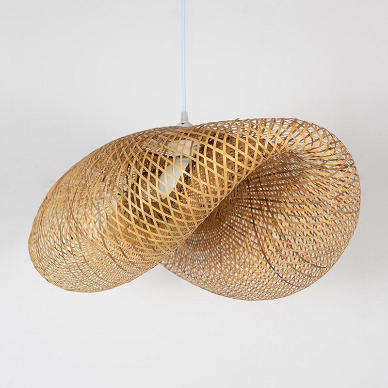 Rattan wave pendant light isolated on a white background.