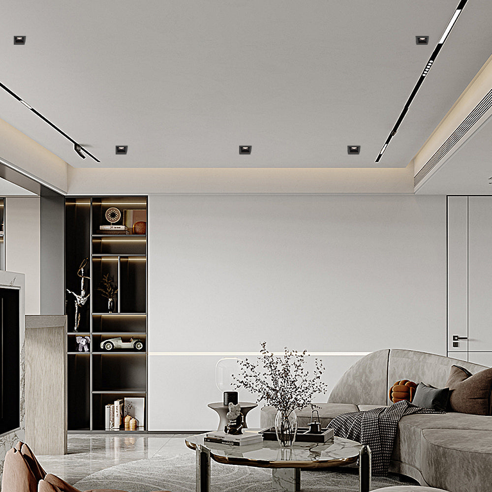 Commercial interior with recessed ceiling spot lights illuminating retail display area.