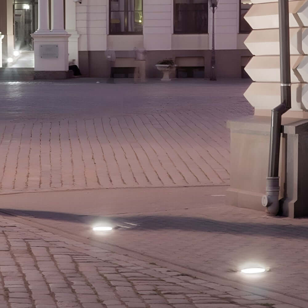 Recessed floor lighting along a garden path, providing subtle illumination for nighttime ambiance.